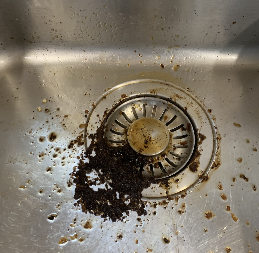 putting coffee grounds down the sink